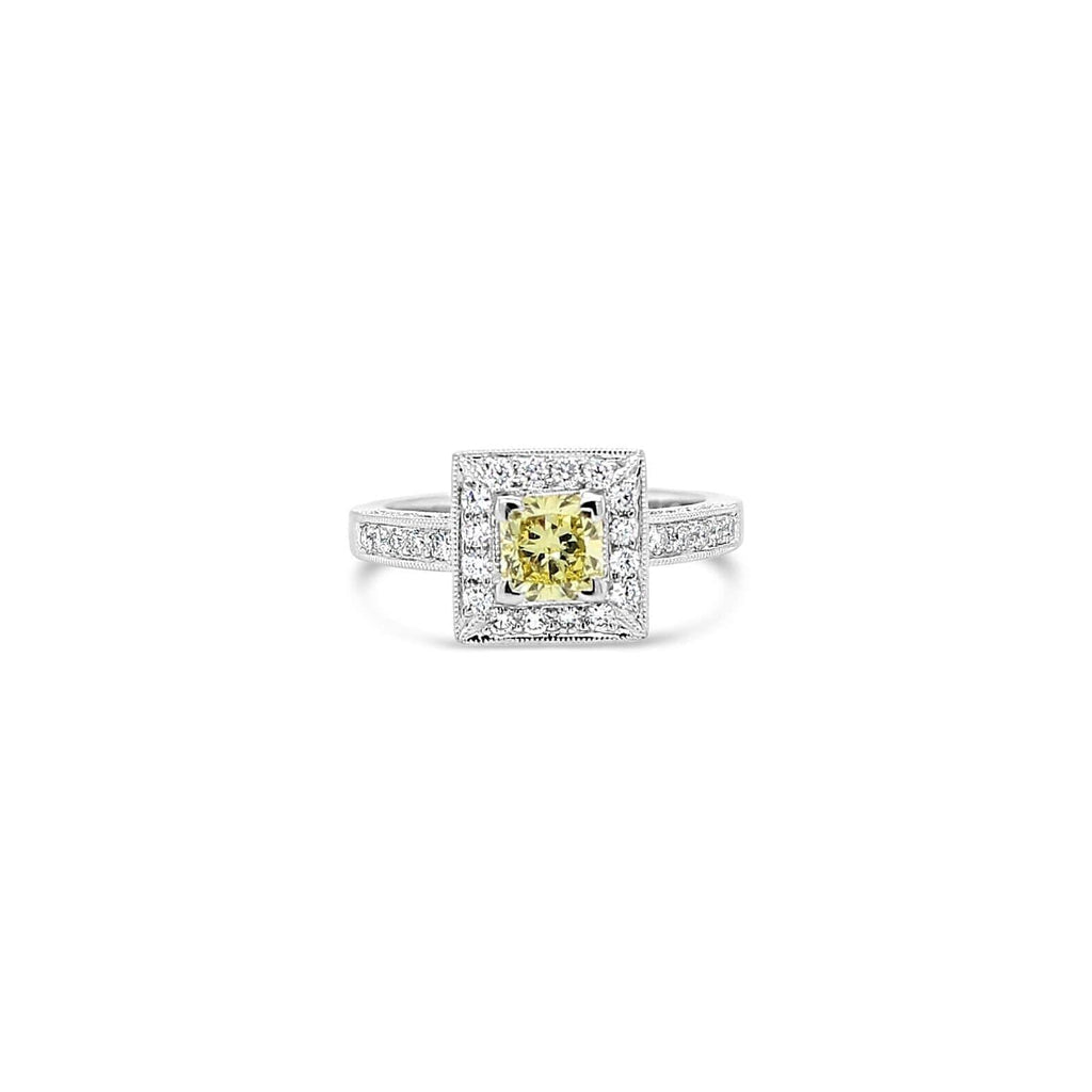 Elevate your style with our exquisite Sunshine Halo Yellow Diamond Ring. A radiant piece that will add a touch of sunshine to any occasion.