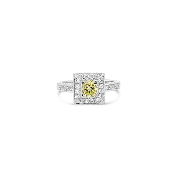 Elevate your style with our exquisite Sunshine Halo Yellow Diamond Ring. A radiant piece that will add a touch of sunshine to any occasion.