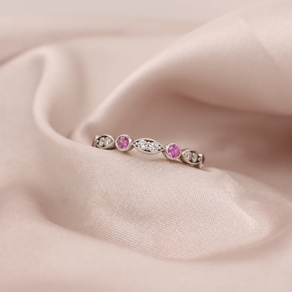 Discover the allure of our Pink Sapphire and Diamond Ring, a stunning piece that will make heads turn wherever you go.