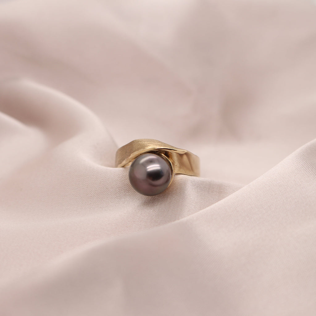 Indulge in the elegance of a yellow gold ring embellished with a captivating Abrolhos pearl. Find your perfect piece at Latitude Jewellers now.