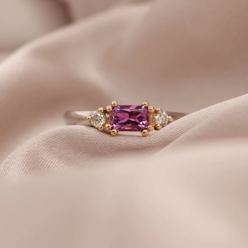 Elevate your style with our exquisite Pink Sapphire and Diamond Ring, a stunning piece that will add a touch of elegance to any outfit.