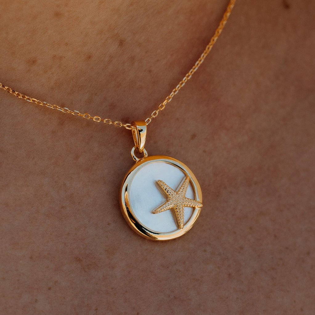 Dive into the beauty of the ocean with our exquisite Starfish and Shell Sterling Silver Necklet. Perfect for adding a touch of elegance to any outfit.