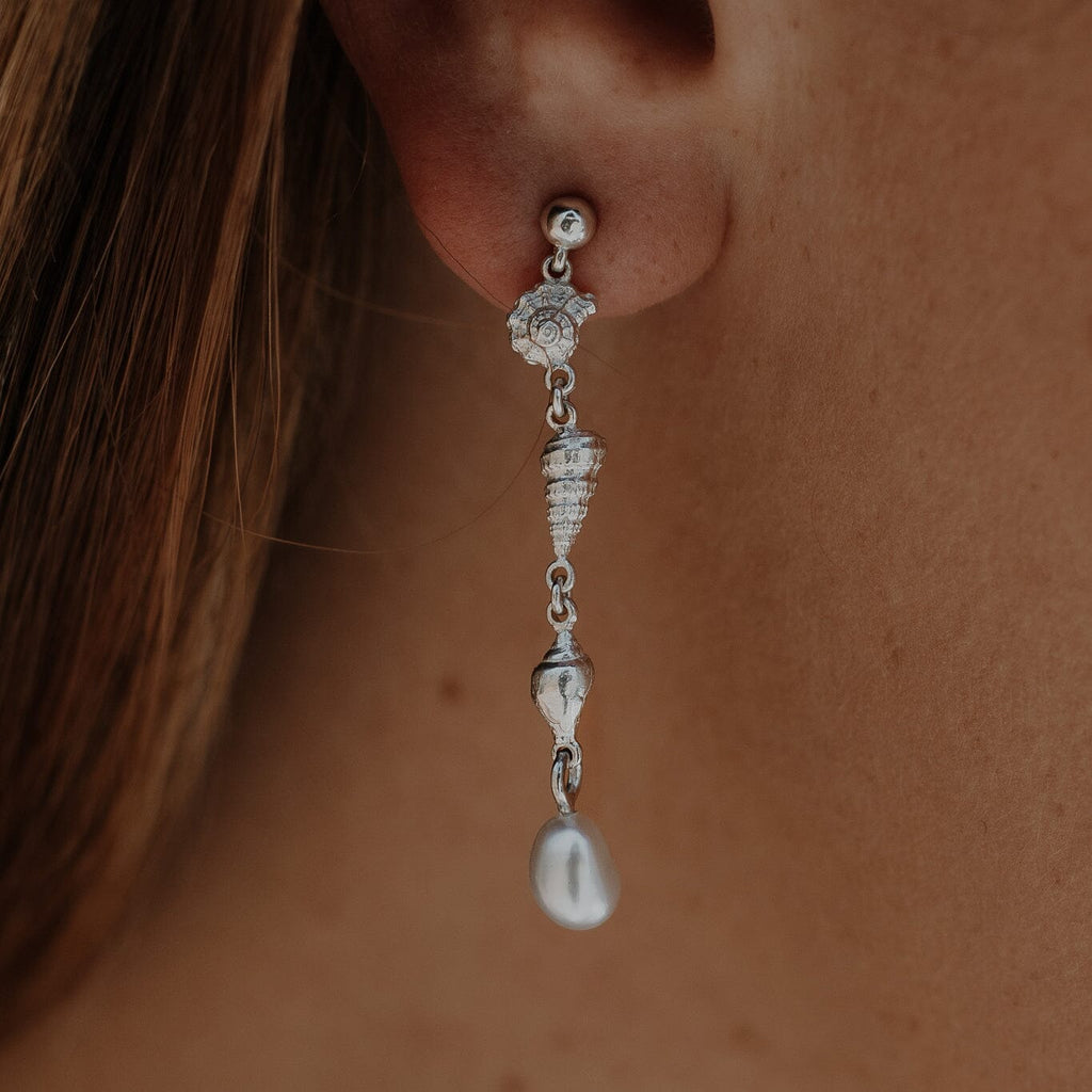 Elevate your style with our stunning Sea Shell Drop Earrings adorned with Abrolhos Keshi Pearls. Discover the perfect blend of elegance and nature-inspired beauty at Latitude Jewellers.