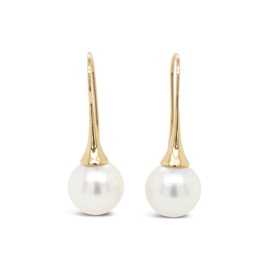 Elevate your style with our exquisite Signature Flute Earrings featuring a stunning South Sea Pearl. Discover timeless elegance at Latitude Jewellers.
