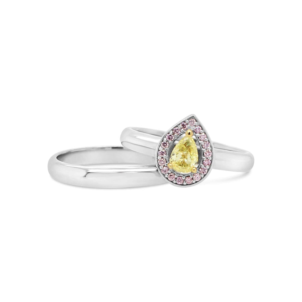  Elevate your love story with our Australian Darling - a stunning pink and yellow diamond wedder set from Latitude Jewellers.