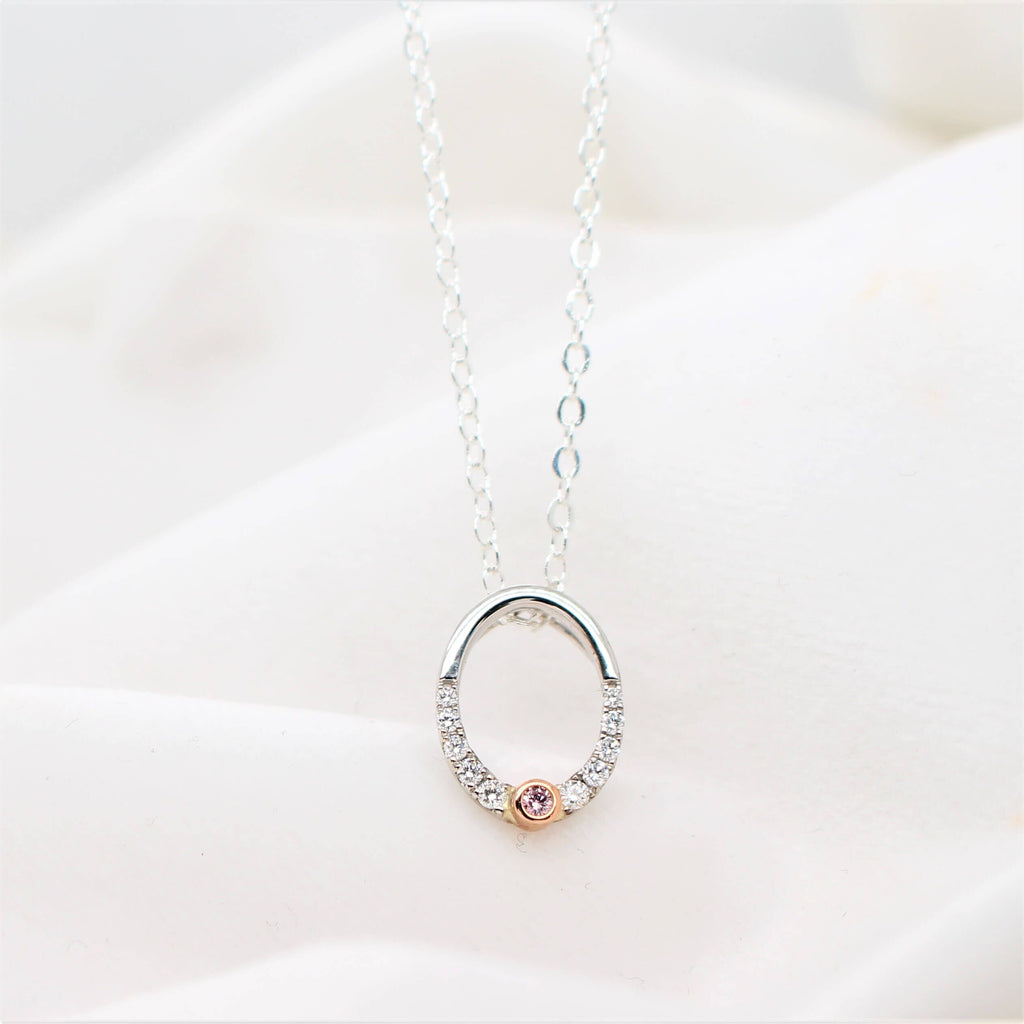 Elevate your style with our exquisite Pink and White Diamond Oval Pendant. Shop now for a touch of elegance that will leave a lasting impression.