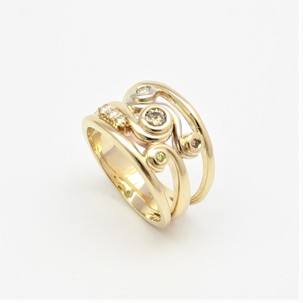 Elevate your style with our exquisite Swirl Ring in Yellow Gold, adorned with sparkling Champagne Diamonds. Discover the perfect blend of elegance and sophistication at Latitude Jewellers.