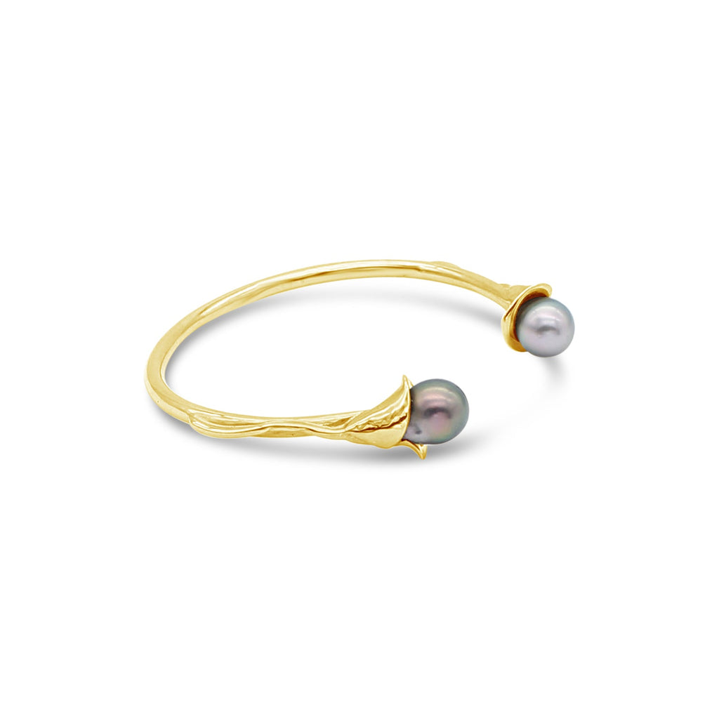 Indulge in the elegance of our Yellow Gold 'Tulip' Cuff featuring captivating Black Pearls sourced from Abrolhos Island