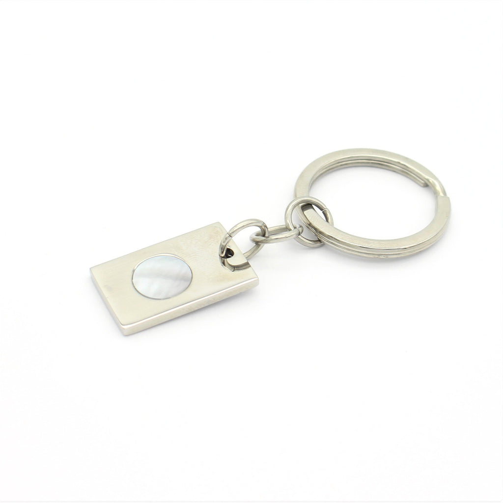 Elevate your style with our exquisite key ring featuring stunning mother of pearl. Shop now at Latitude Jewellers