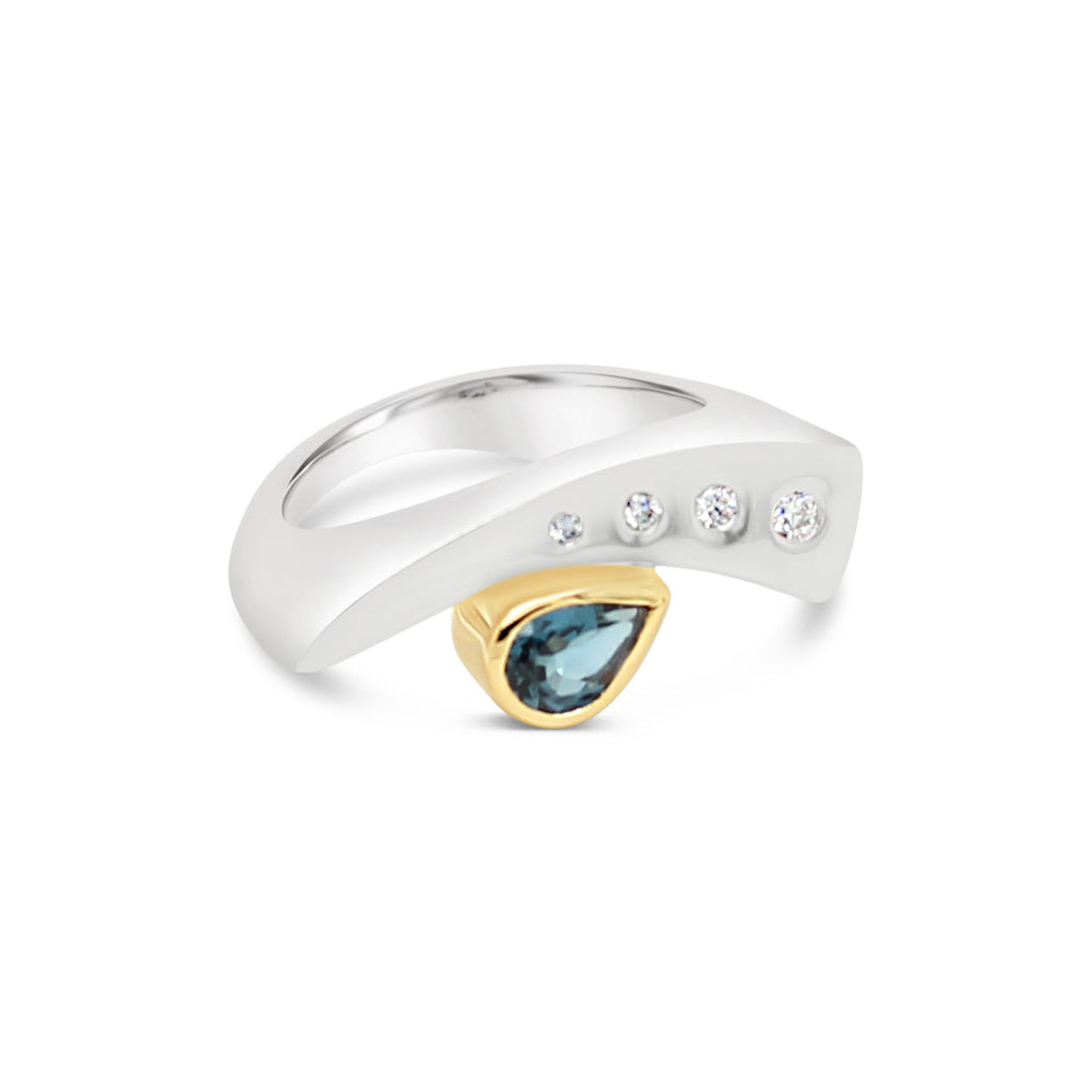  Elevate your style with our exquisite London Blue Topaz & Diamond Yellow Gold and Sterling Silver Ring.