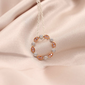 Elevate your style with our exquisite Pink and White Marquise Diamond Circle Pendant.