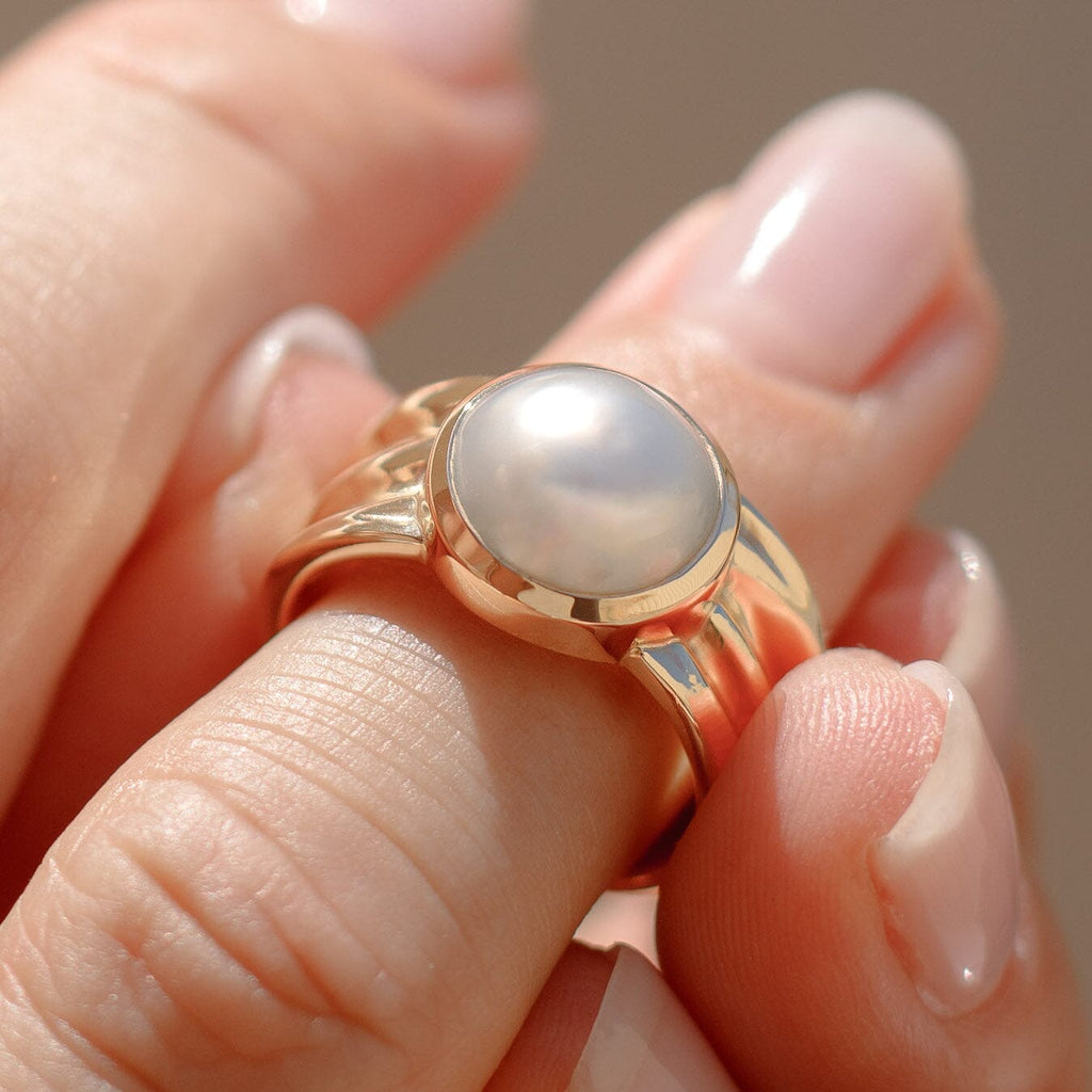 Discover the elegance of the Oily Calm Tapered Ring with Pearl at Latitude Jewellers - a stunning piece that exudes tranquility and sophistication.