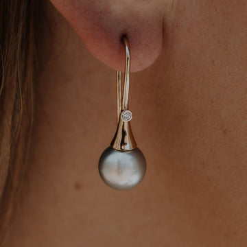 Elevate your style with our exquisite Signature Flute Earrings featuring Abrolhos pearls and dazzling diamonds. Shop now at Latitude Jewellers