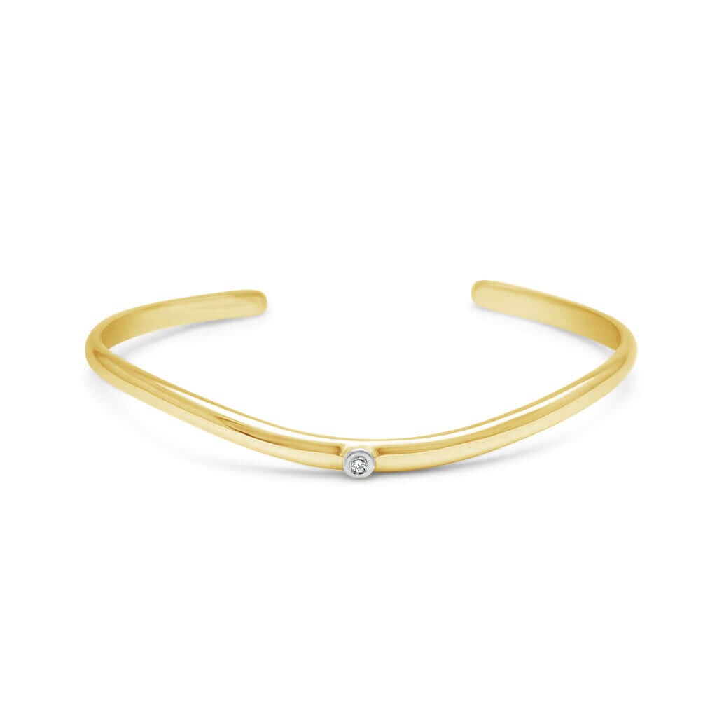 Discover the perfect blend of elegance and sophistication with our Yellow Gold Skyline Cuff featuring a radiant diamond. Explore our collection at Latitude Jewellers.
