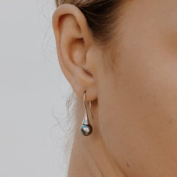 Elevate your style with our exquisite Abrolhos Pearl Flute Earrings in 18ct white gold.