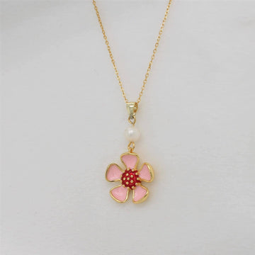 . Discover the enchanting allure of our Enamel Wild Flower Necklace - a delicate pendant that captures the essence of Geraldton Wax in exquisite detail