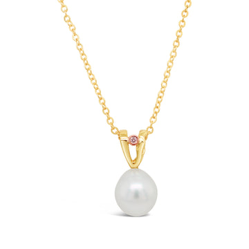 Argyle Pink Diamond featured on a Yellow Gold Wave Pendant with South Sea Pearl