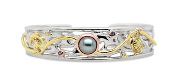 Dive into elegance with our Ocean's Embrace Cuff, a stunning piece from Latitude Jewellers.