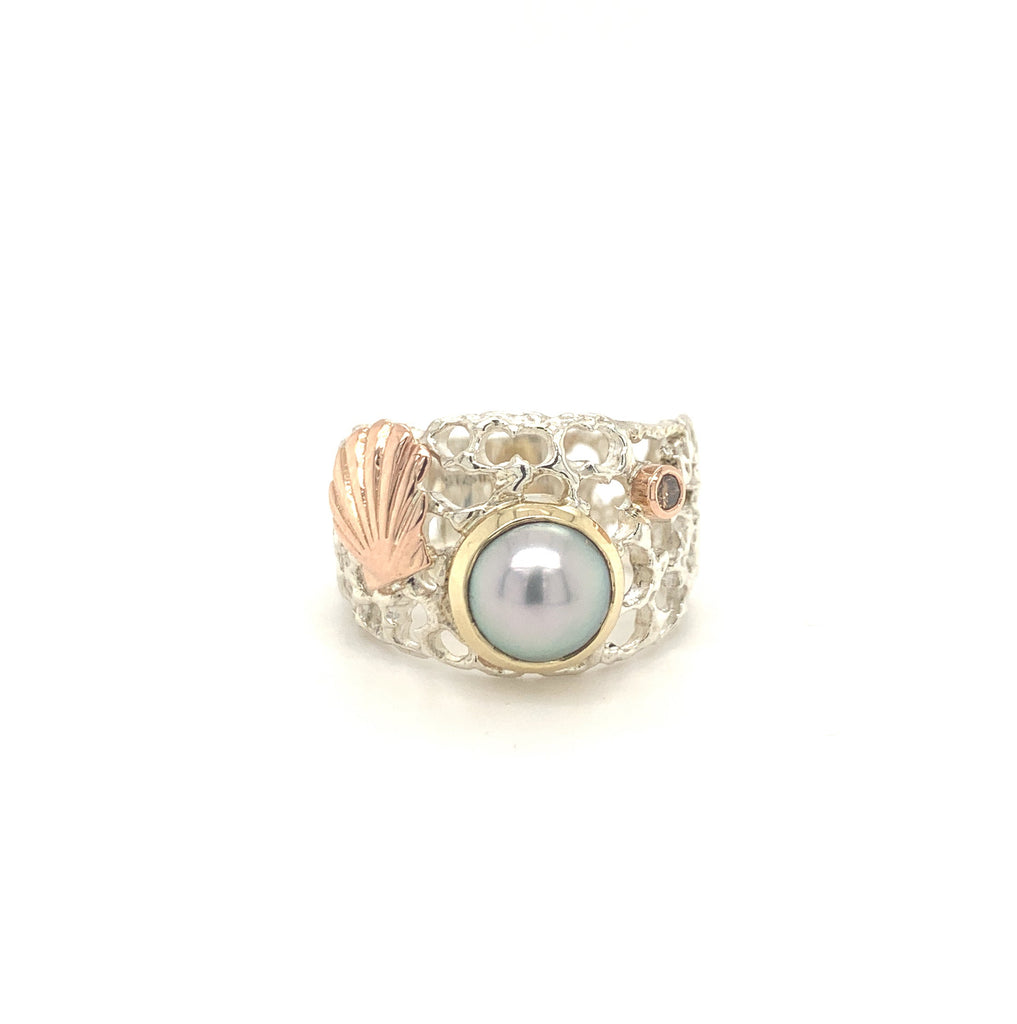 Dive into elegance with our Ocean's Festival Ring, featuring a stunning combination of pearl, scallop, and champagne diamond in yellow and rose gold.