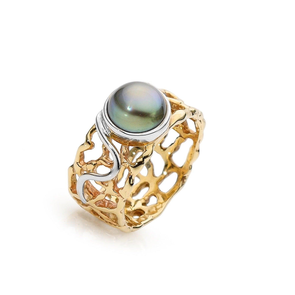 Dive into the tranquil beauty of the Ocean's Serenity Ring, a stunning piece from Latitude Jewellers that captures the essence of the sea with its lustrous pearl centerpiece.