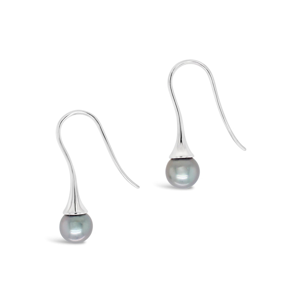 Elevate your style with our signature flute earrings featuring stunning Abrolhos black pearls. Shop now at Latitude Jewellers